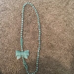 Jade green Beaded Necklace with Bow.
15 inches long , over the head